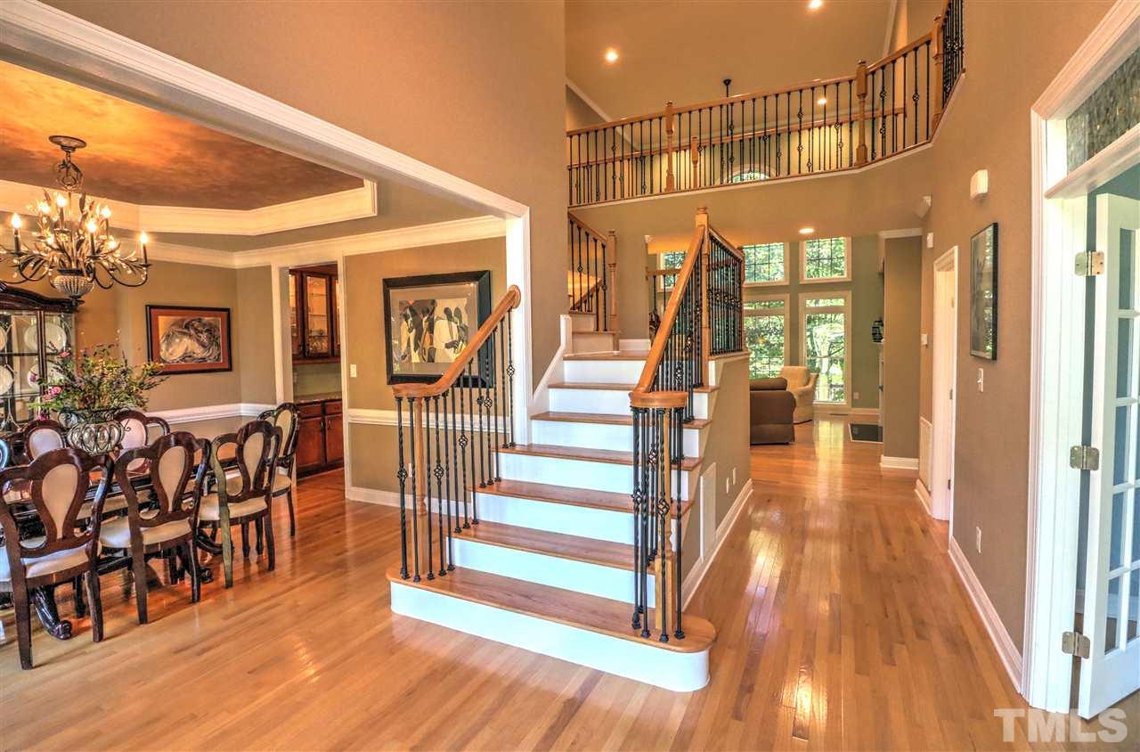 2408 Loring Court Raleigh, NC 27613 - Photo 2 of 25 a view of entryway and hall with wooden floor