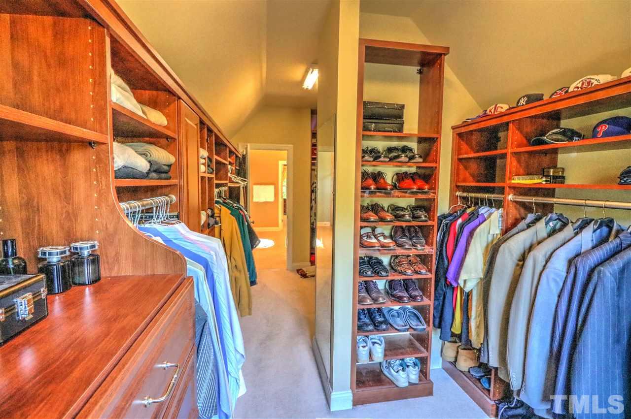 2408 Loring Court Raleigh, NC 27613 - Photo 12 of 25 a view of walk in closet with clothes and shoes