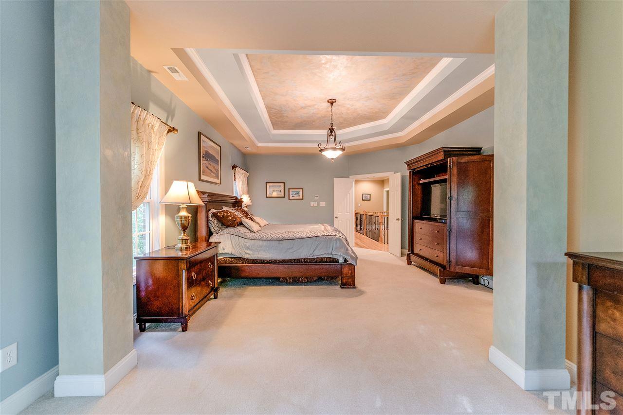 2408 Loring Court Raleigh, NC 27613 - Photo 13 of 25 a bedroom with furniture and a window