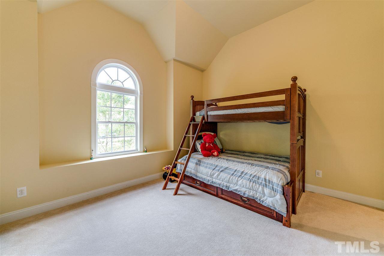 2408 Loring Court Raleigh, NC 27613 - Photo 17 of 25 a room with a bed and window