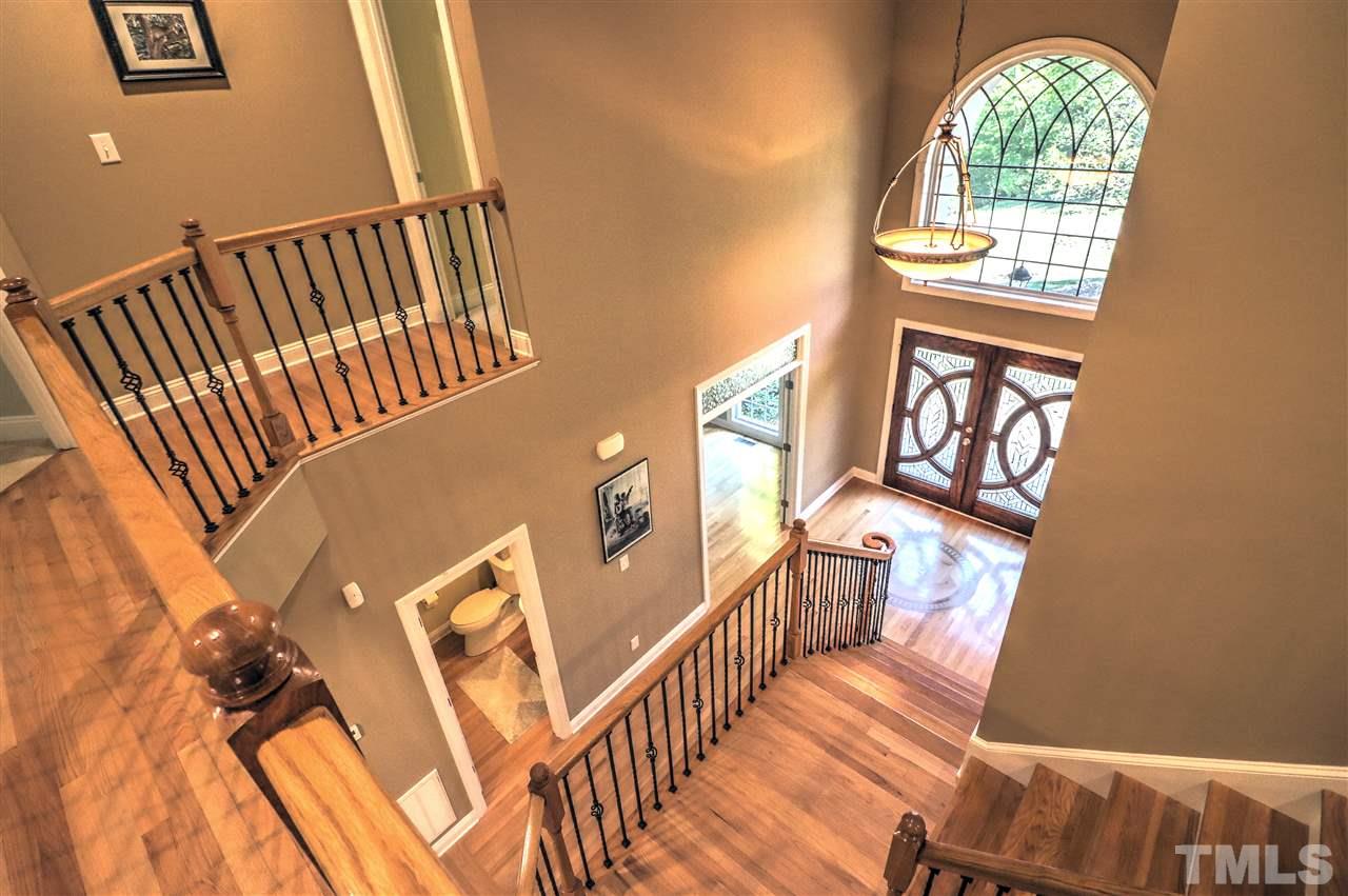 2408 Loring Court Raleigh, NC 27613 - Photo 18 of 25 a view of an entryway with wooden floor