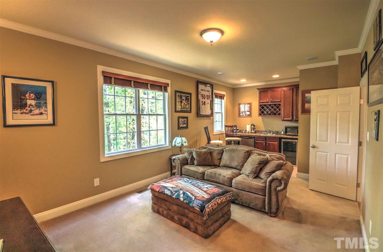 2408 Loring Court Raleigh, NC 27613 - Photo 20 of 25 a living room with furniture and a window