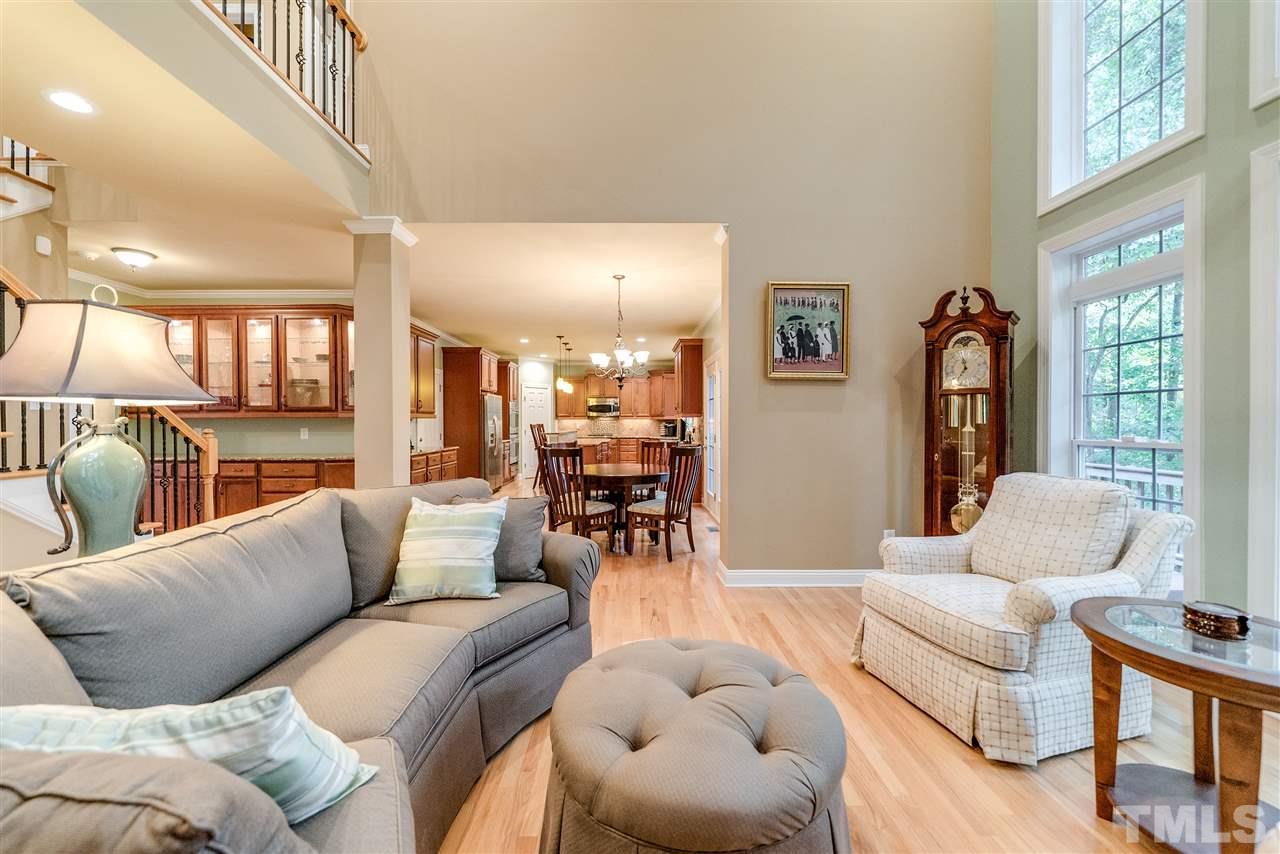 2408 Loring Court Raleigh, NC 27613 - Photo 21 of 25 a living room with furniture and a large window