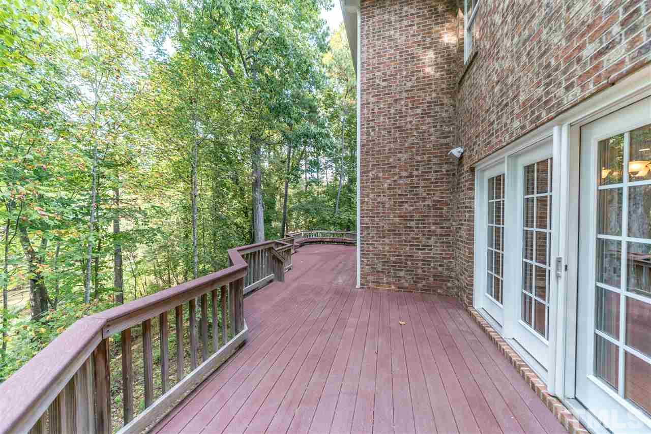 2408 Loring Court Raleigh, NC 27613 - Photo 22 of 25 a view of balcony with wooden floor and fence