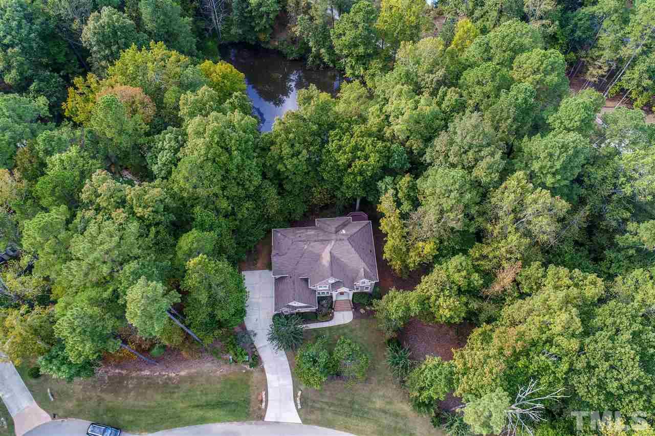 2408 Loring Court Raleigh, NC 27613 - Photo 25 of 25 an aerial view of a house with a yard and large trees