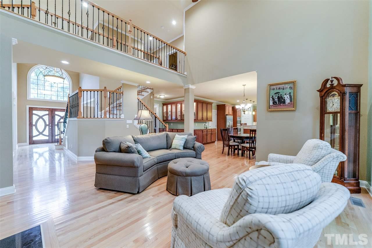 2408 Loring Court Raleigh, NC 27613 - Photo 7 of 25 a living room with furniture and wooden floor