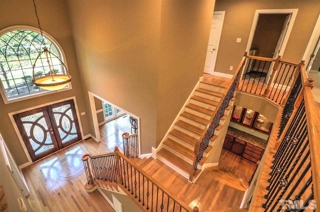 2408 Loring Court Raleigh, NC 27613 - Photo 8 of 25 a view of an entryway with wooden floor