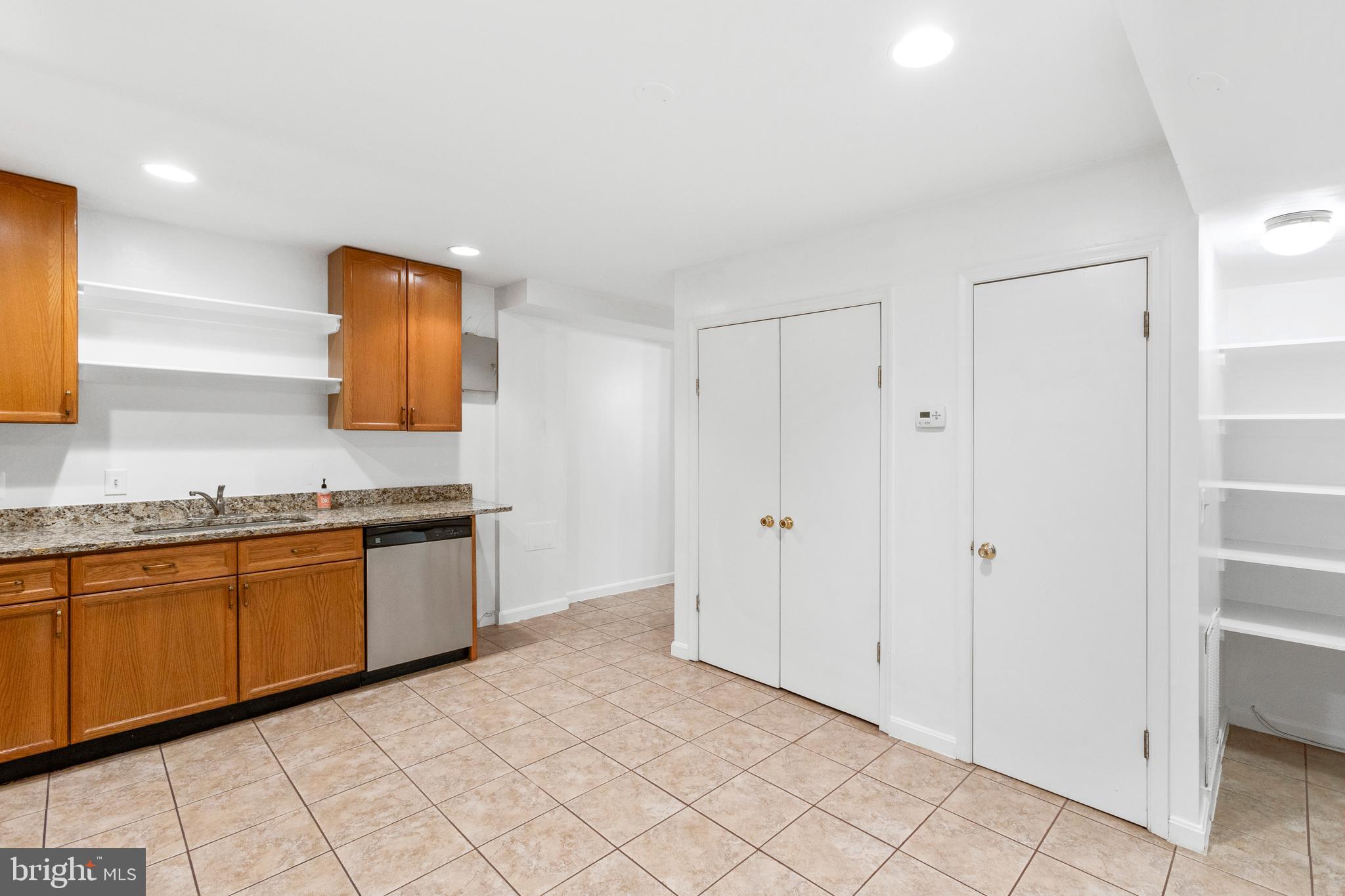 431 4th Street Northeast Washington, DC 20002 - Photo 21 of 37 a large bathroom with a granite countertop sink and a mirror