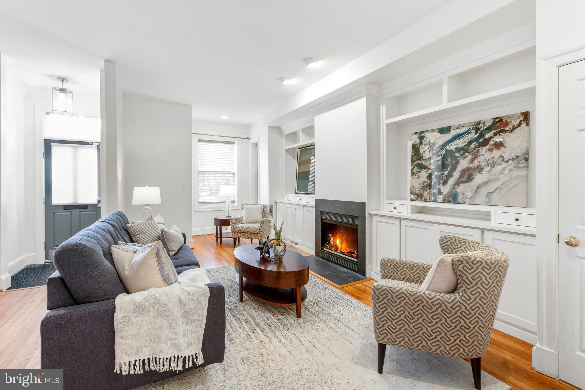 431 4th Street Northeast Washington, DC 20002 - Photo 4 of 37 a living room with furniture and a fireplace