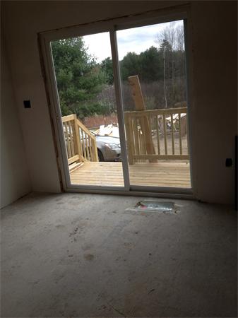 19 Shawnee Road, Unit 1 Pepperell, MA 01463 - Photo 15 of 18 a view of a room with wooden floor and garden