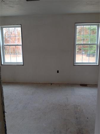19 Shawnee Road, Unit 1 Pepperell, MA 01463 - Photo 17 of 18 an empty room with a window