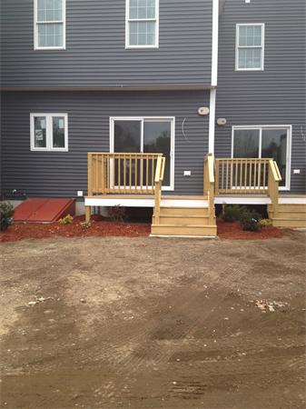 19 Shawnee Road, Unit 1 Pepperell, MA 01463 - Photo 3 of 18 a front view of a house with a yard