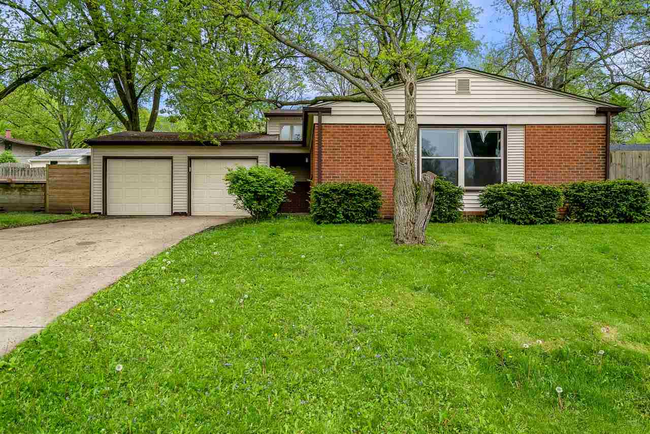 5114 Highcrest Road Rockford, IL 61107 - Photo 1 of 36 a front view of house with yard and green space
