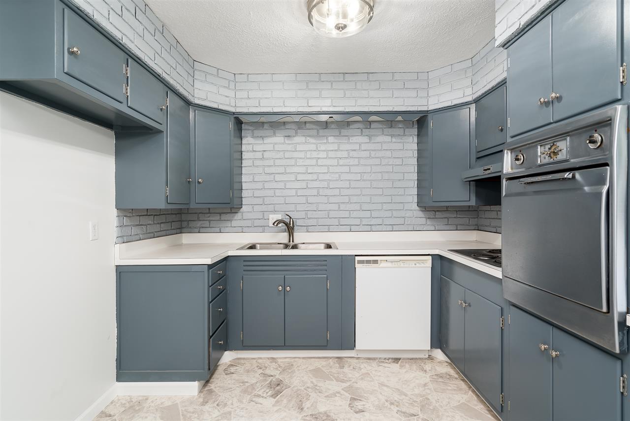 5114 Highcrest Road Rockford, IL 61107 - Photo 13 of 36 a kitchen with a sink cabinets and stainless steel appliances