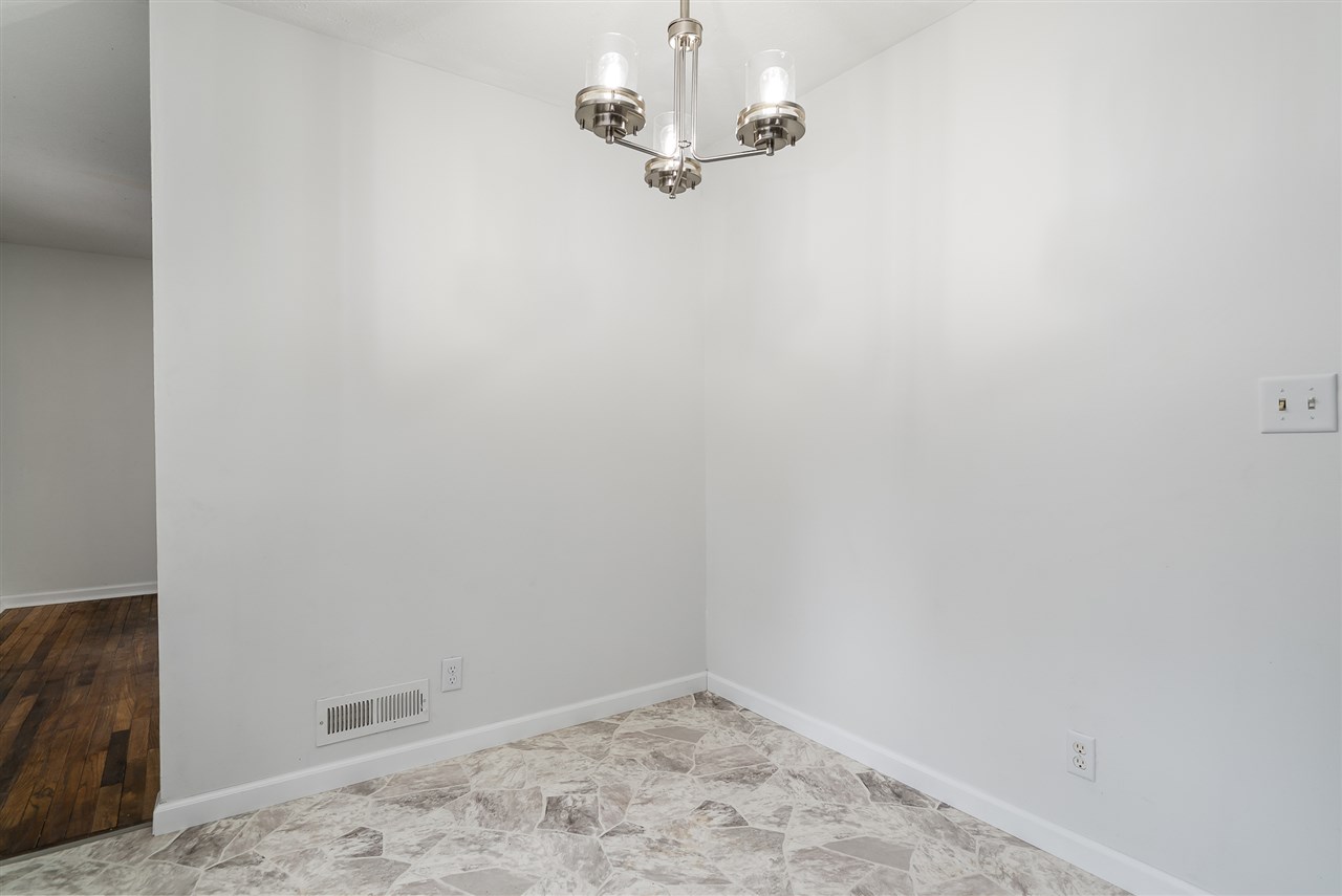5114 Highcrest Road Rockford, IL 61107 - Photo 17 of 36 a view of a decorative light in a empty room