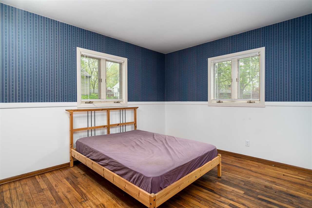 5114 Highcrest Road Rockford, IL 61107 - Photo 19 of 36 a bedroom with a bed and window
