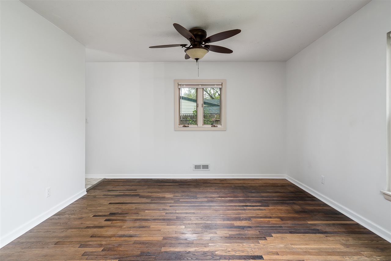 5114 Highcrest Road Rockford, IL 61107 - Photo 9 of 36 wooden floor in an empty room with a window