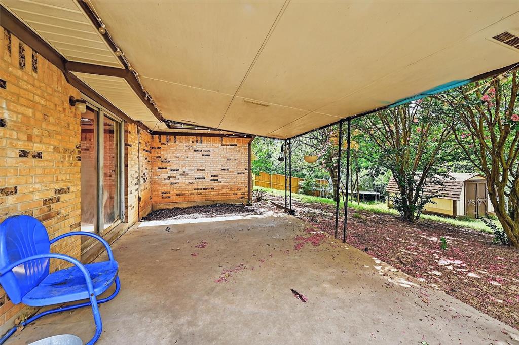 813 Glen Key Street Denison, TX 75020 - Photo 25 of 28 View of patio with a storage shed