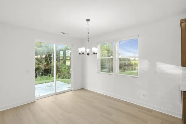 a bathroom with a double vanity sink a mirror and a shower