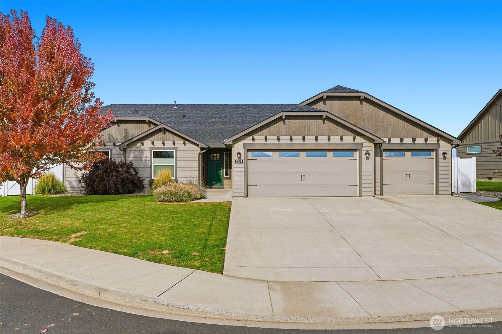 1339 Caprio Loop Walla Walla, WA 99362 - Photo 1 of 37 a front view of a house with a yard and garage