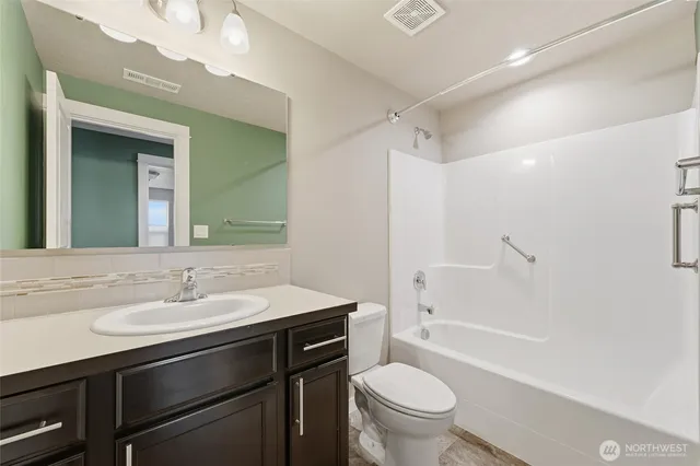 a bathroom with a sink a toilet and a bathtub