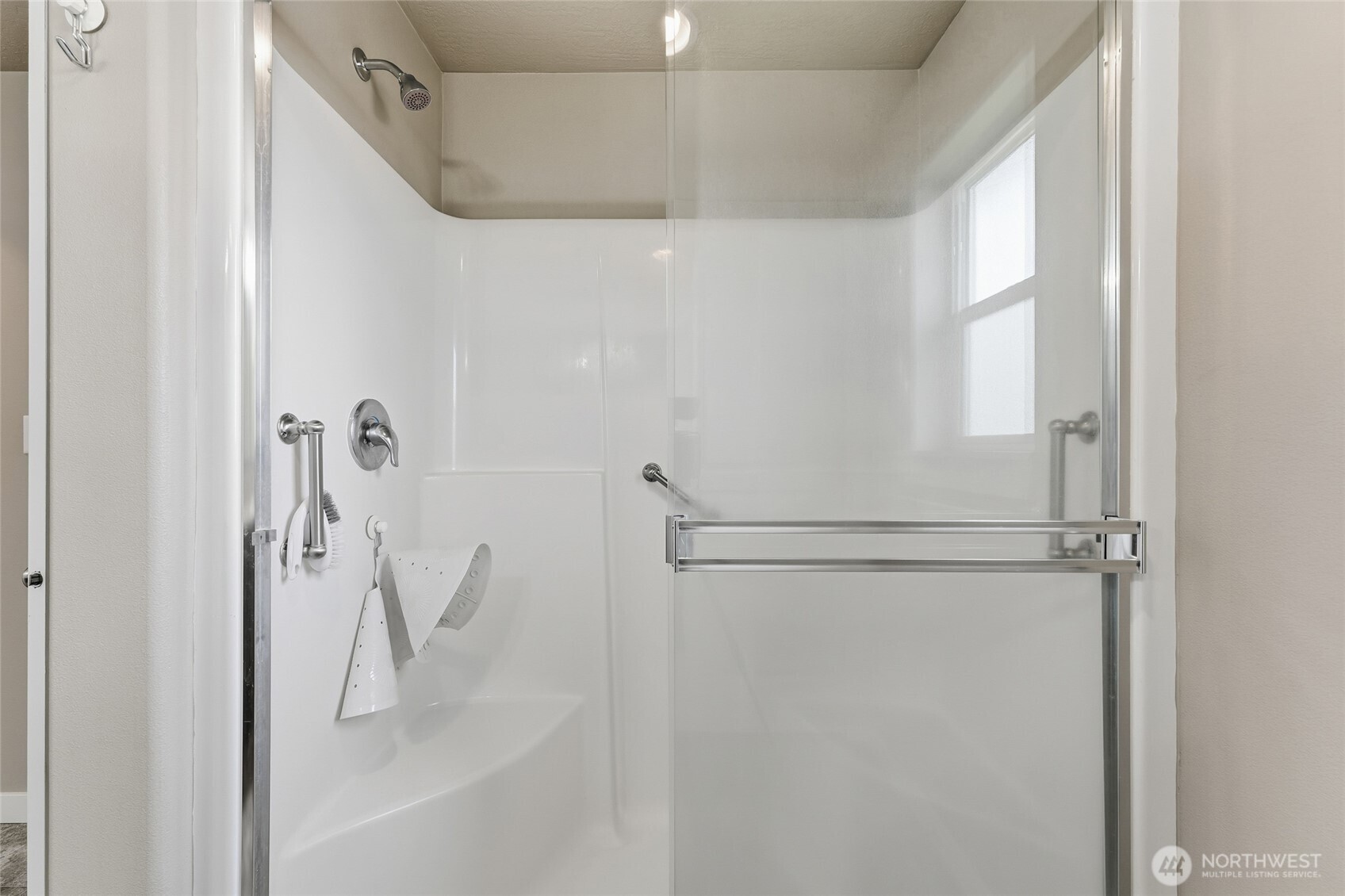 1339 Caprio Loop Walla Walla, WA 99362 - Photo 18 of 37 a bathroom with a glass shower door