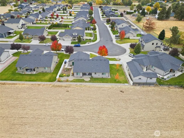 an aerial view of a houses with outdoor space