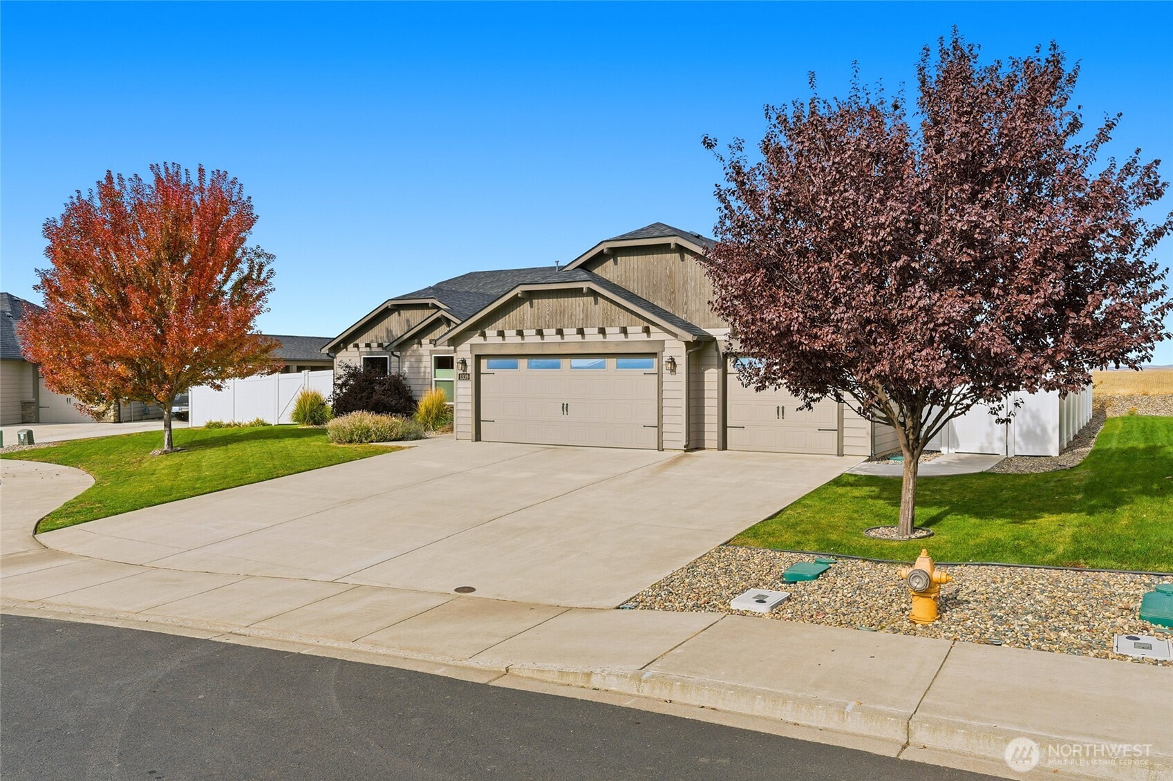 1339 Caprio Loop Walla Walla, WA 99362 - Photo 37 of 37 a front view of a house with a yard and garage