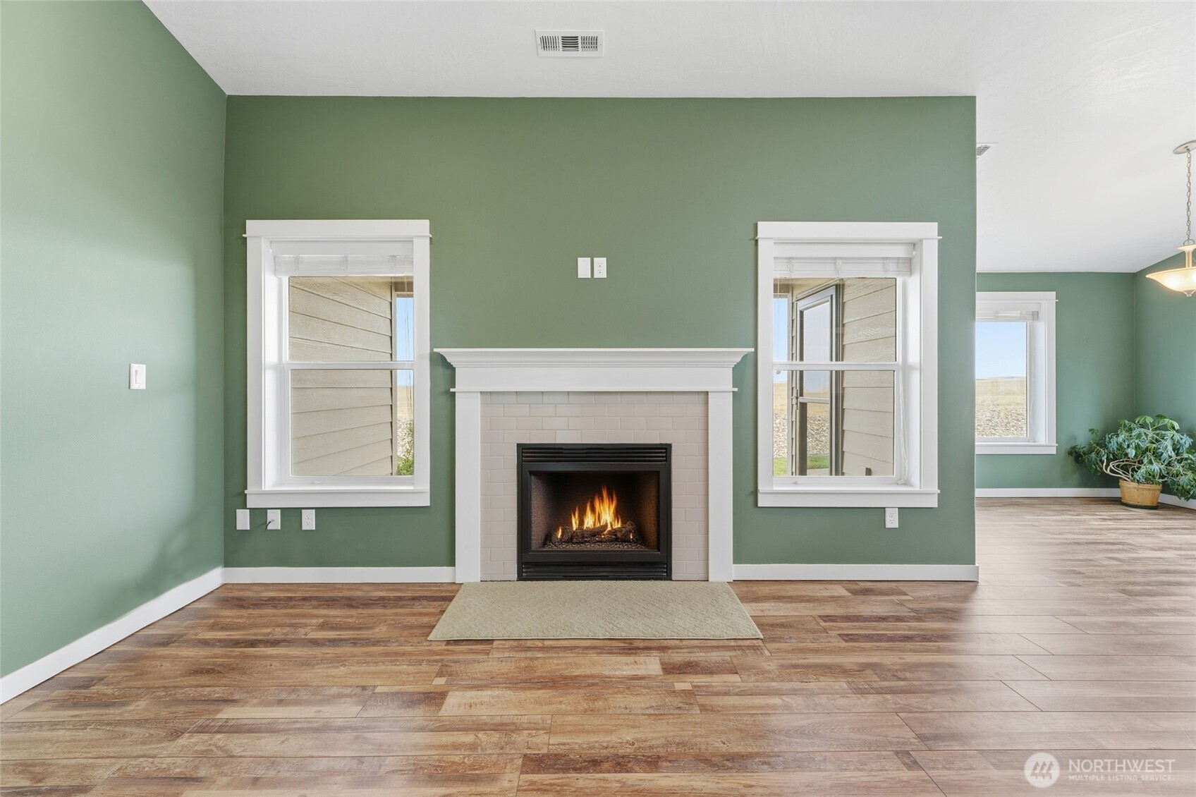 1339 Caprio Loop Walla Walla, WA 99362 - Photo 4 of 37 a view of a livingroom with a fireplace and window
