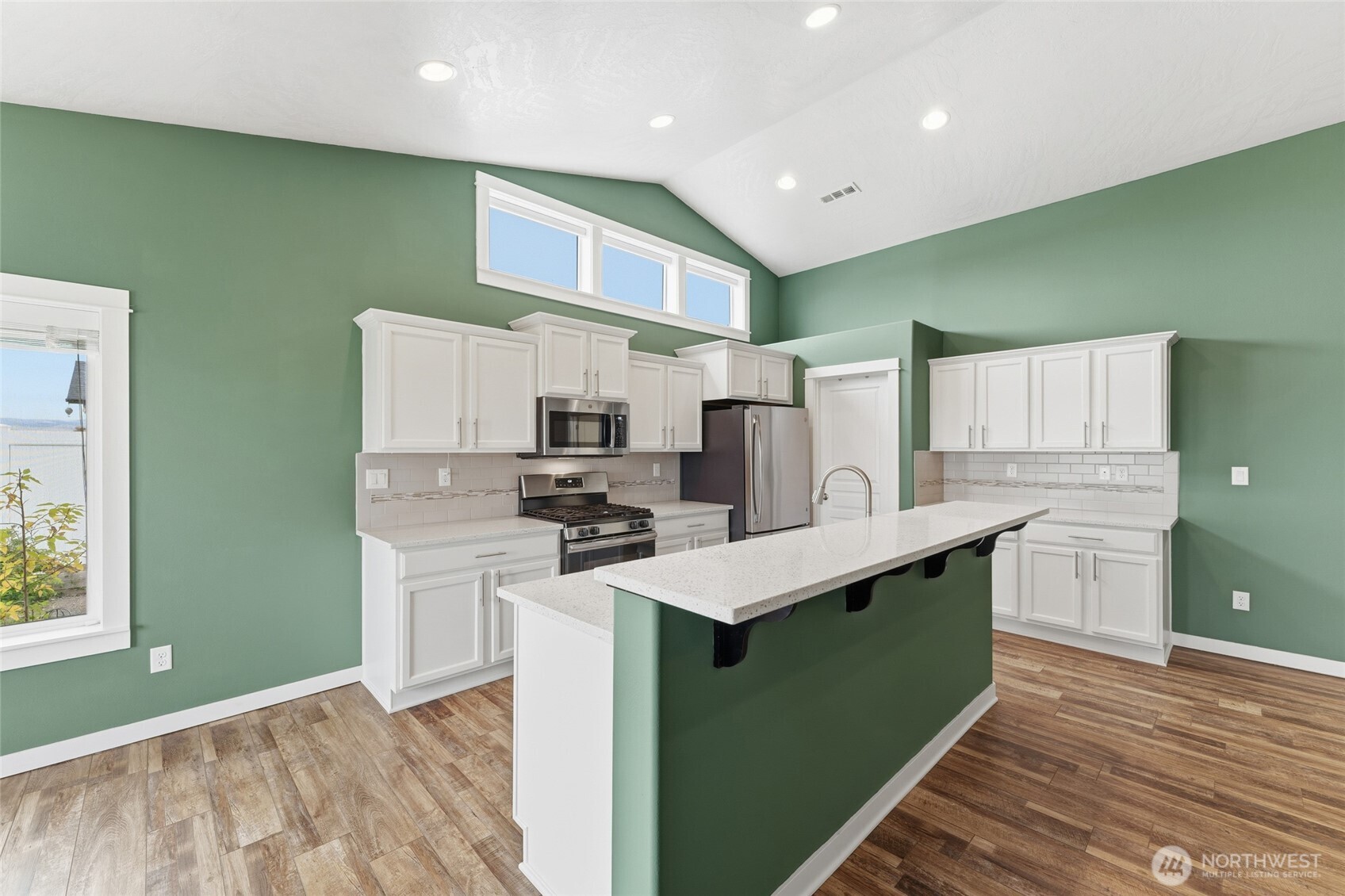 1339 Caprio Loop Walla Walla, WA 99362 - Photo 6 of 37 a kitchen with stainless steel appliances a sink stove and refrigerator