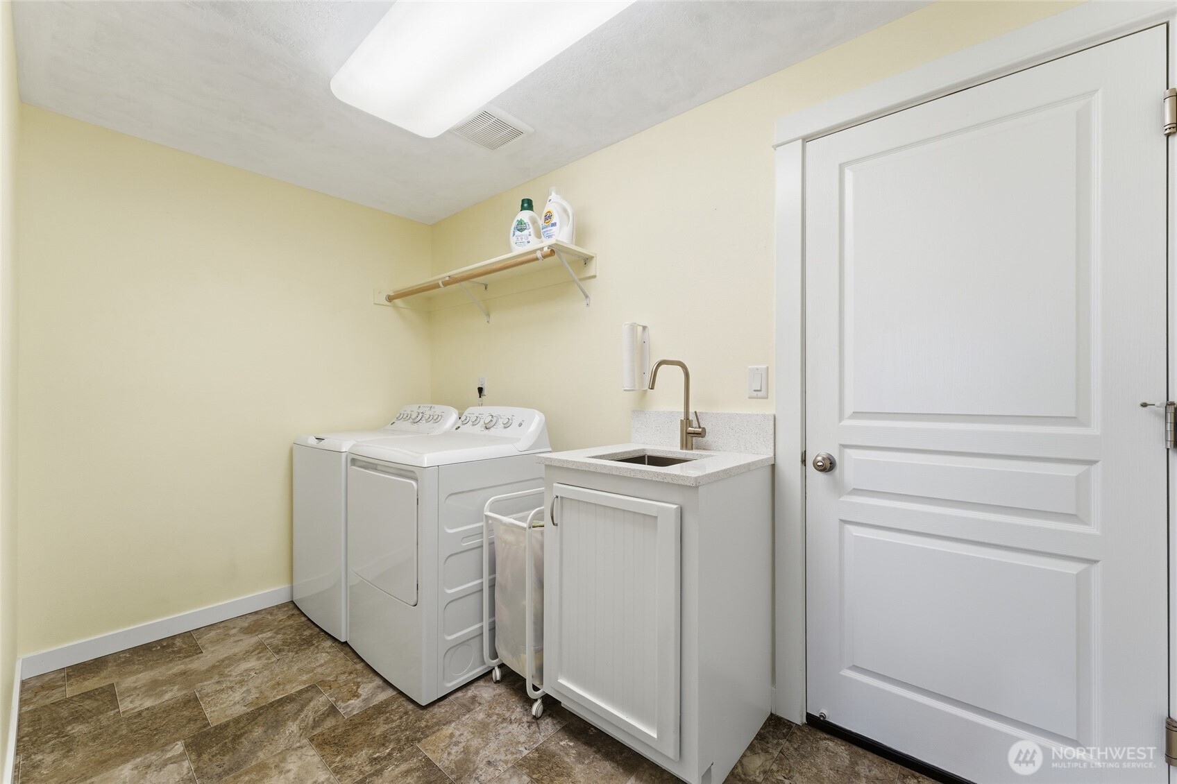 1339 Caprio Loop Walla Walla, WA 99362 - Photo 8 of 37 a utility room with a sink washer and dryer