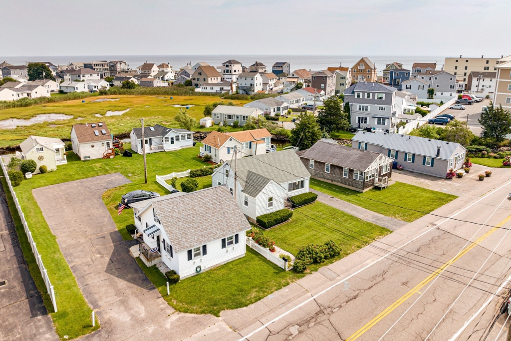558 Winnacunnet Road Hampton, NH 03842 - Photo 11 of 40 an aerial view of residential houses with outdoor space and swimming pool