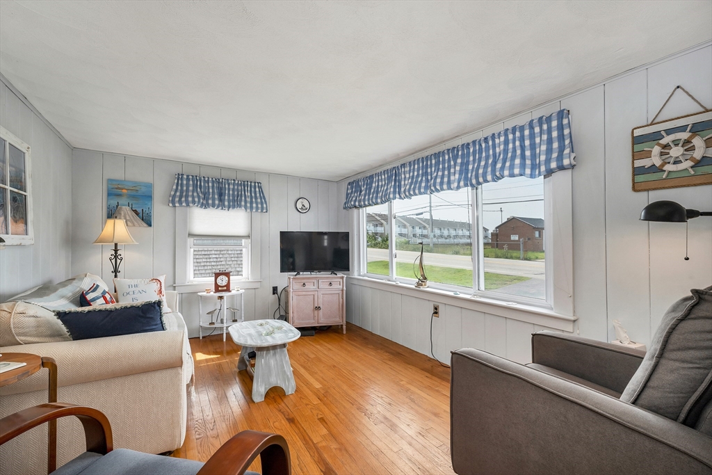 558 Winnacunnet Road Hampton, NH 03842 - Photo 25 of 40 a living room with furniture and a large window