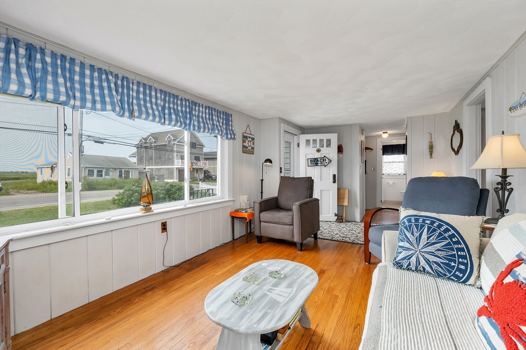 558 Winnacunnet Road Hampton, NH 03842 - Photo 28 of 40 a living room with furniture and a large window