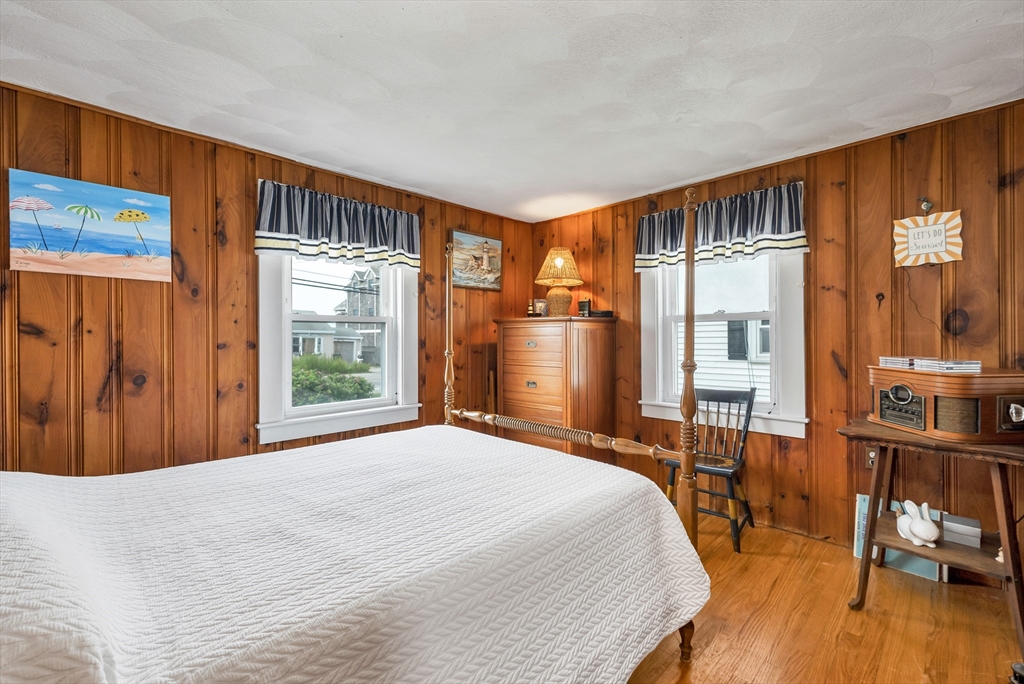 558 Winnacunnet Road Hampton, NH 03842 - Photo 33 of 40 a bedroom with a large bed and a large window