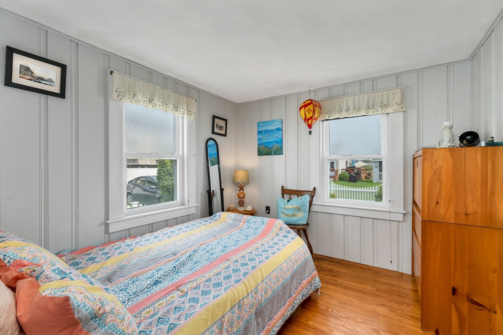 558 Winnacunnet Road Hampton, NH 03842 - Photo 35 of 40 a bedroom with a bed and a window
