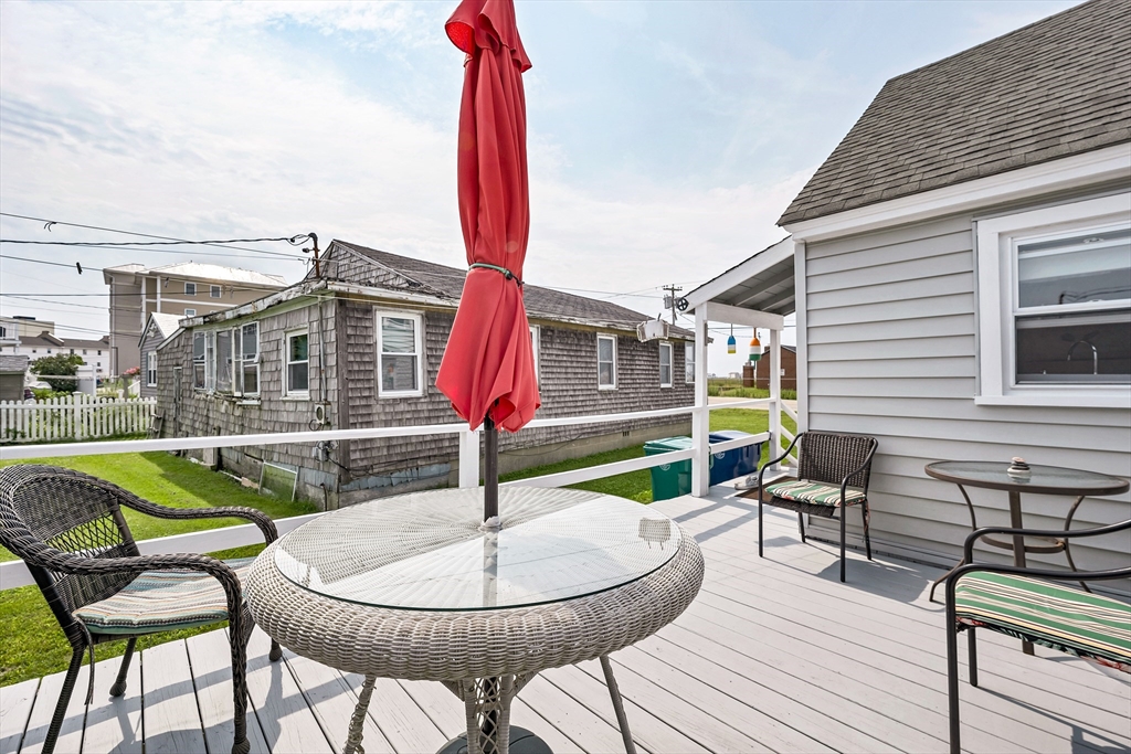 558 Winnacunnet Road Hampton, NH 03842 - Photo 39 of 40 a view of a patio with couches table and chairs
