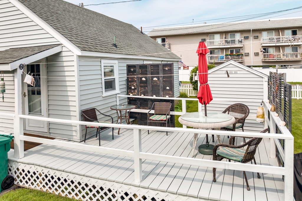 558 Winnacunnet Road Hampton, NH 03842 - Photo 4 of 40 a view of a chairs and table in the patio
