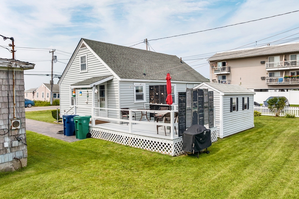 558 Winnacunnet Road Hampton, NH 03842 - Photo 5 of 40 a view of a house with a backyard and sitting area