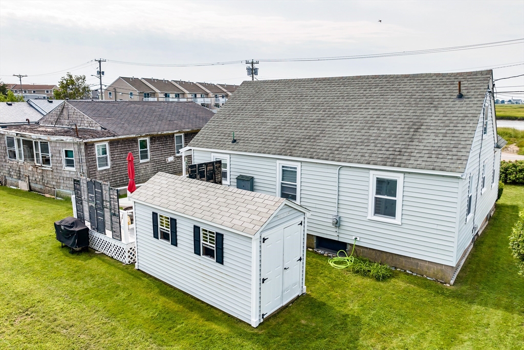 558 Winnacunnet Road Hampton, NH 03842 - Photo 8 of 40 a aerial view of residential houses with yard and deck
