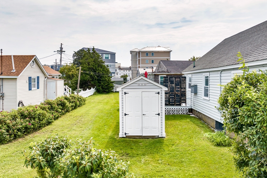 558 Winnacunnet Road Hampton, NH 03842 - Photo 9 of 40 a front view of house with yard and trees in the background