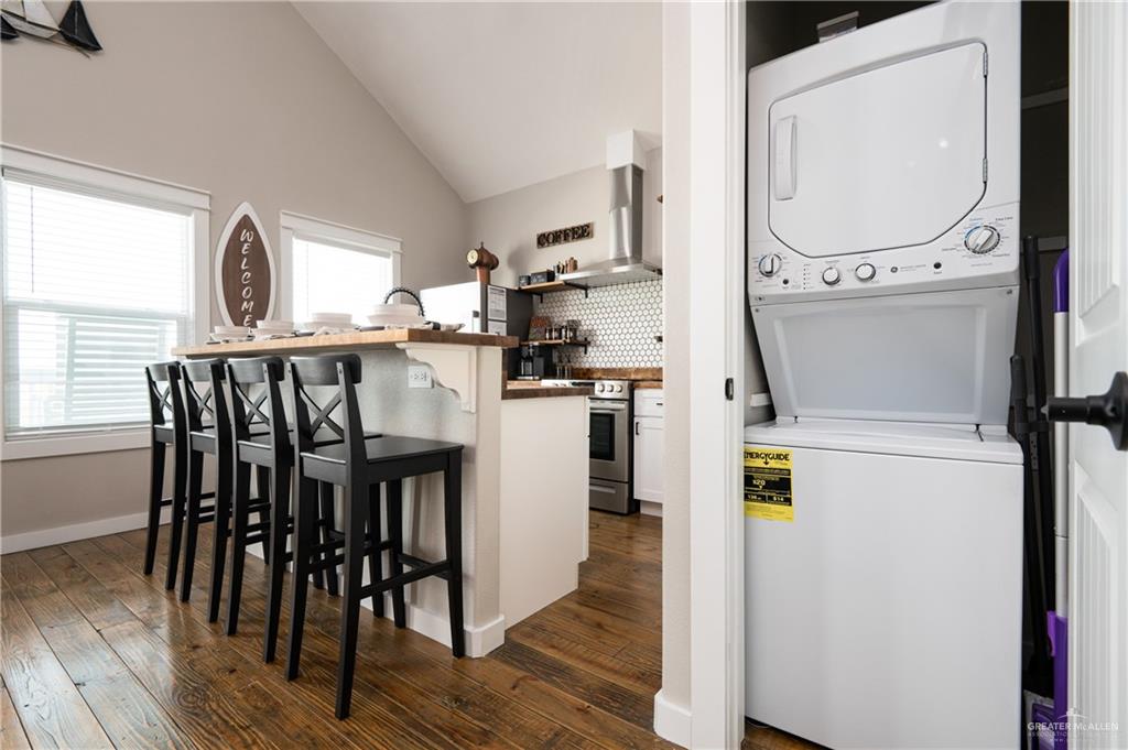 1053 Johnson Road Port Bolivar, TX 77617 - Photo 13 of 27 a view of a kitchen with furniture and wooden floor