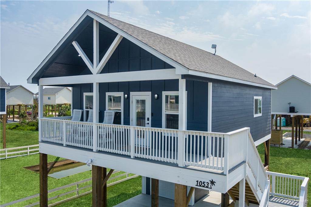 1053 Johnson Road Port Bolivar, TX 77617 - Photo 2 of 27 a view of a house with wooden deck and furniture