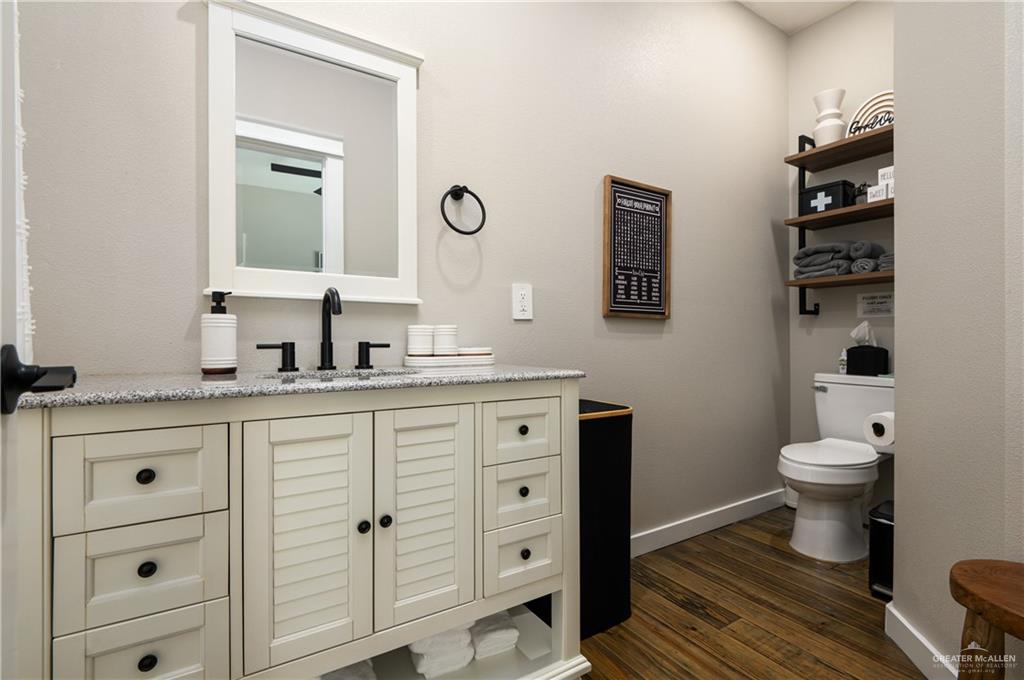 1053 Johnson Road Port Bolivar, TX 77617 - Photo 21 of 27 a bathroom with a toilet a sink and a mirror