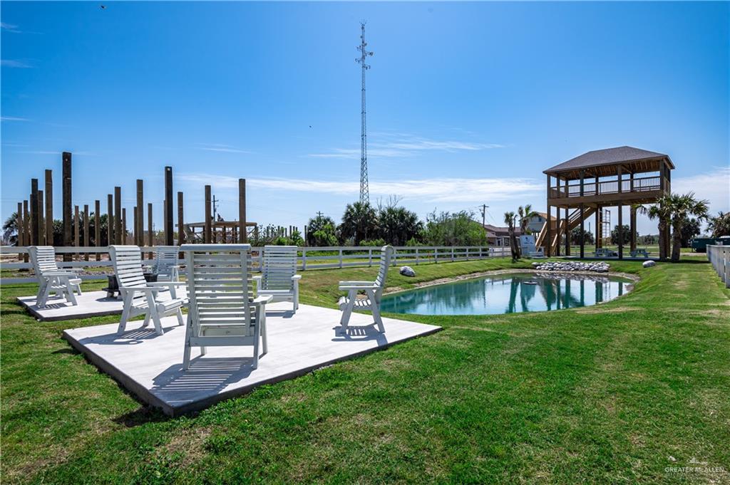 1053 Johnson Road Port Bolivar, TX 77617 - Photo 24 of 27 a view of a swimming pool with a patio