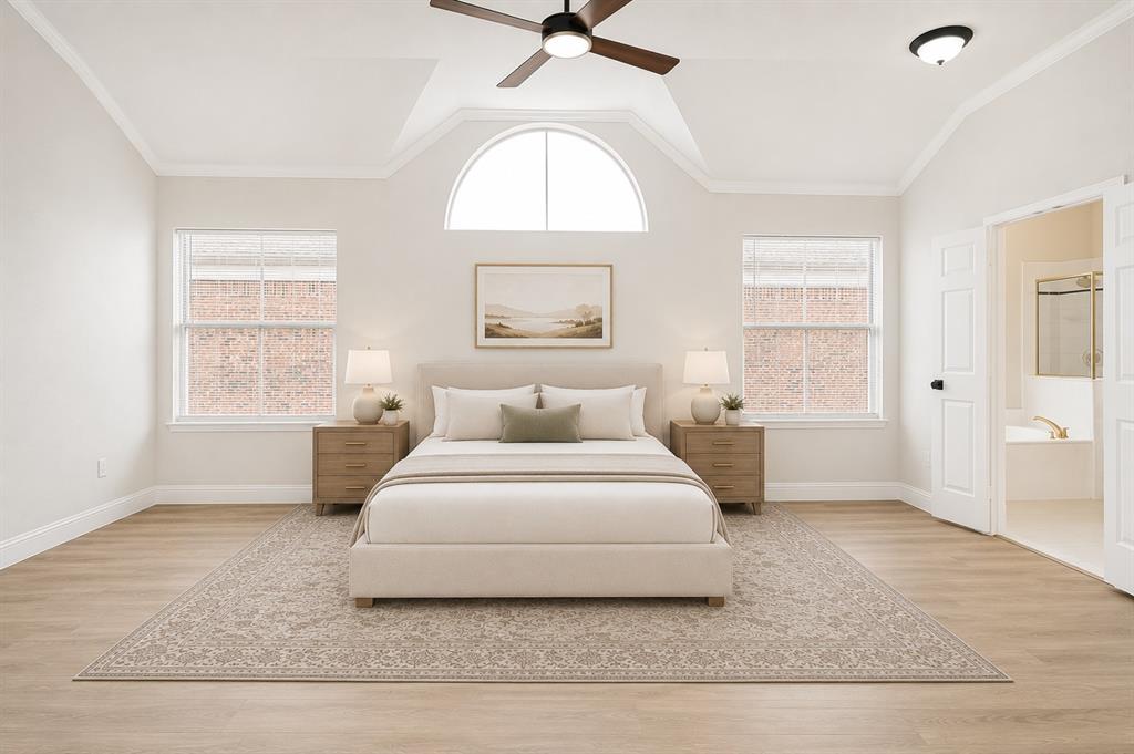 3020 Ridge Hollow Drive Plano, TX 75023 - Photo 19 of 28 Vaulted ceilings featuring a ceiling fan, wood-finish flooring, and a large arched window