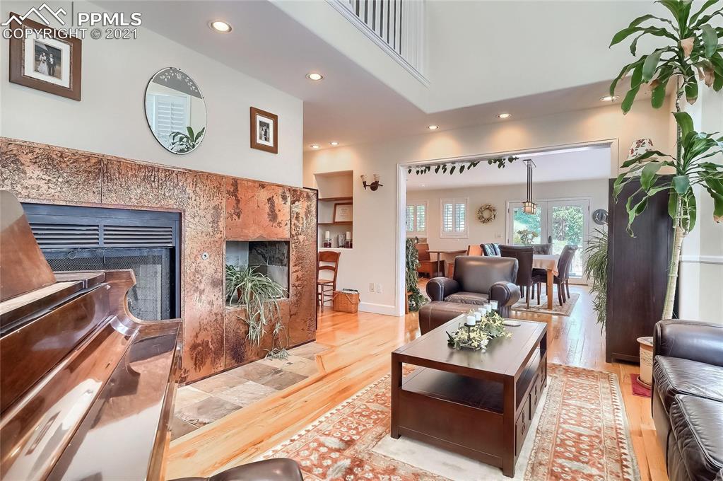 623 West Meadow Road Evergreen, CO 80439 - Photo 14 of 49 a living room with furniture and a fireplace