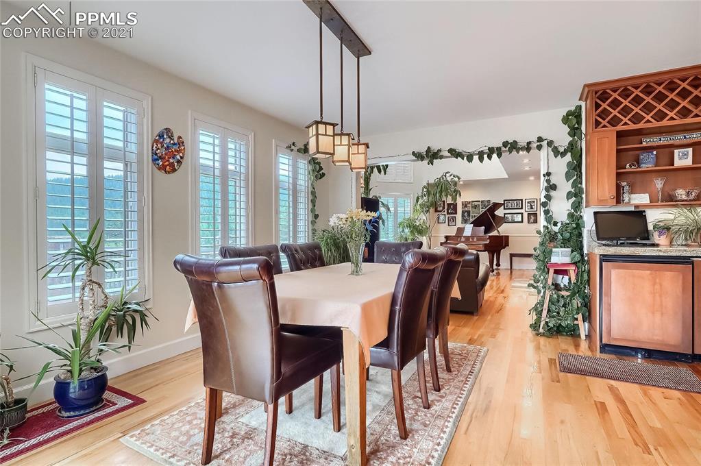623 West Meadow Road Evergreen, CO 80439 - Photo 17 of 49 a view of a dining room with furniture window and wooden floor