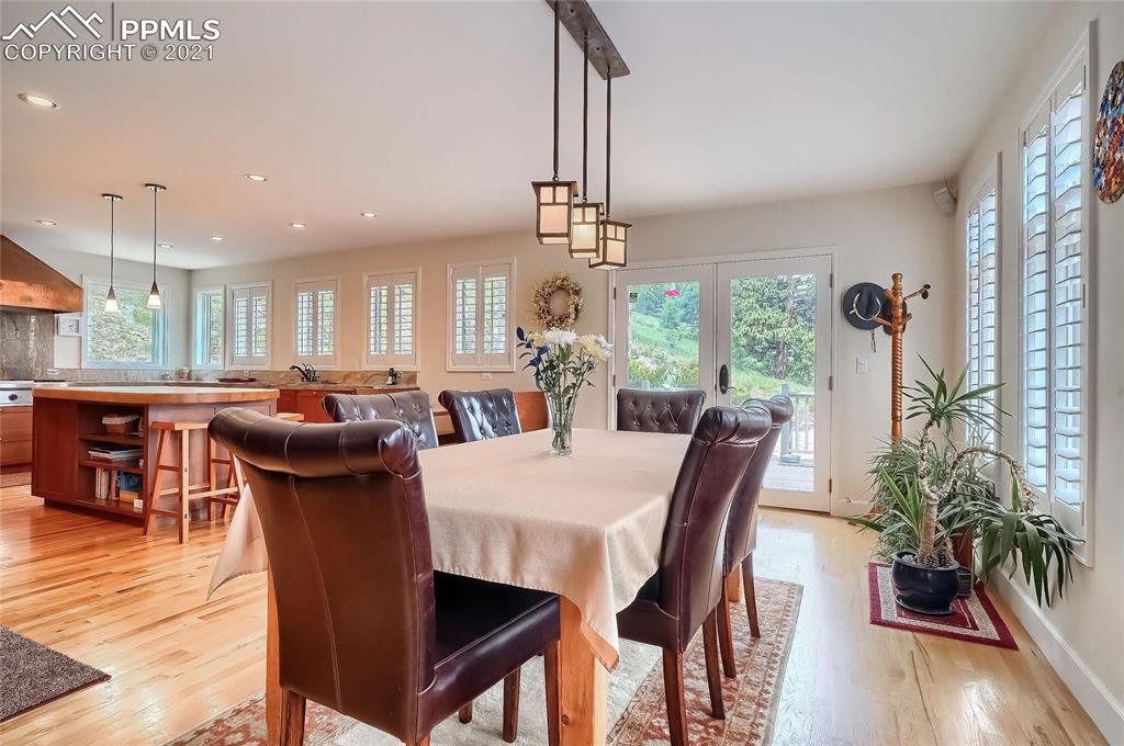 623 West Meadow Road Evergreen, CO 80439 - Photo 18 of 49 a view of a dining room with furniture window and wooden floor