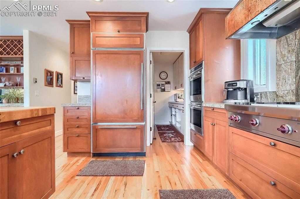 623 West Meadow Road Evergreen, CO 80439 - Photo 25 of 49 a kitchen with a refrigerator and a sink